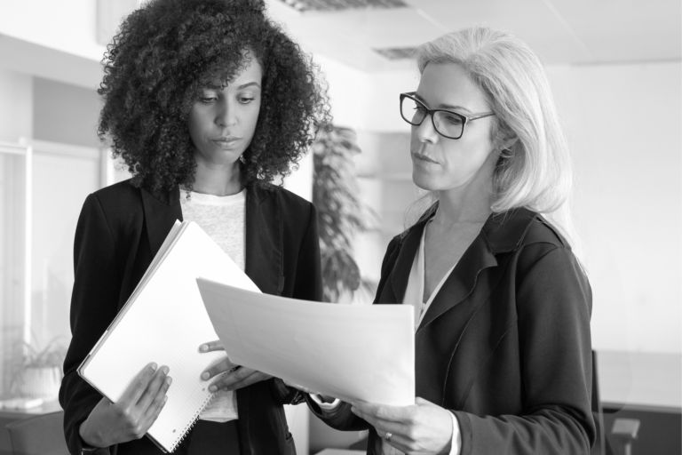 Two professionals reviewing trust documents
