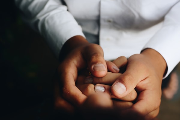 Hands held together in support