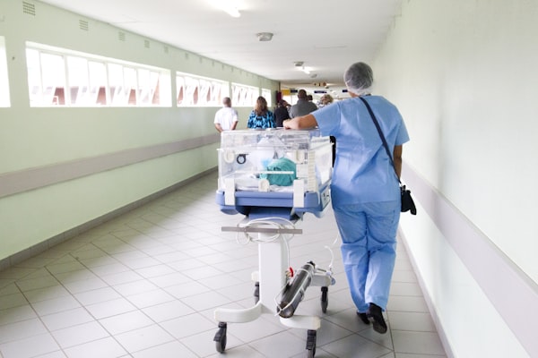 Patient being wheeled through a hospital corridor